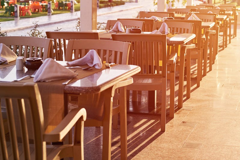 Empty terrace with a table and chairs outdoor in sunset