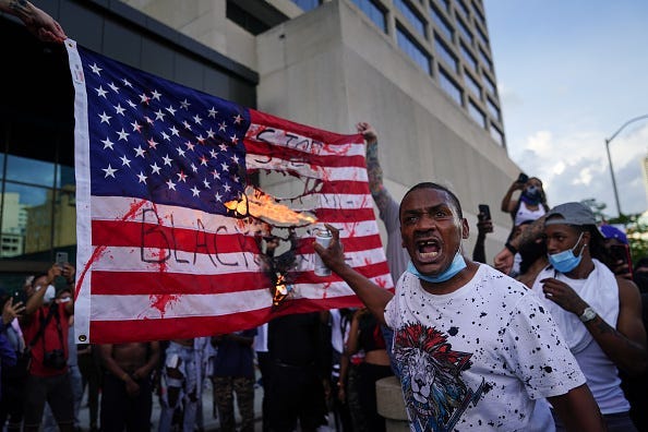 Black Lives Matter protesters burn American flag