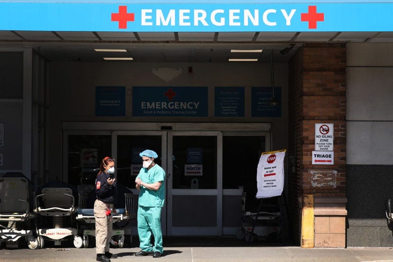 NEW YORK, NY - APRIL 02: Medical workers wait for patients at a special coronavirus intake area at Maimonides Medical Center