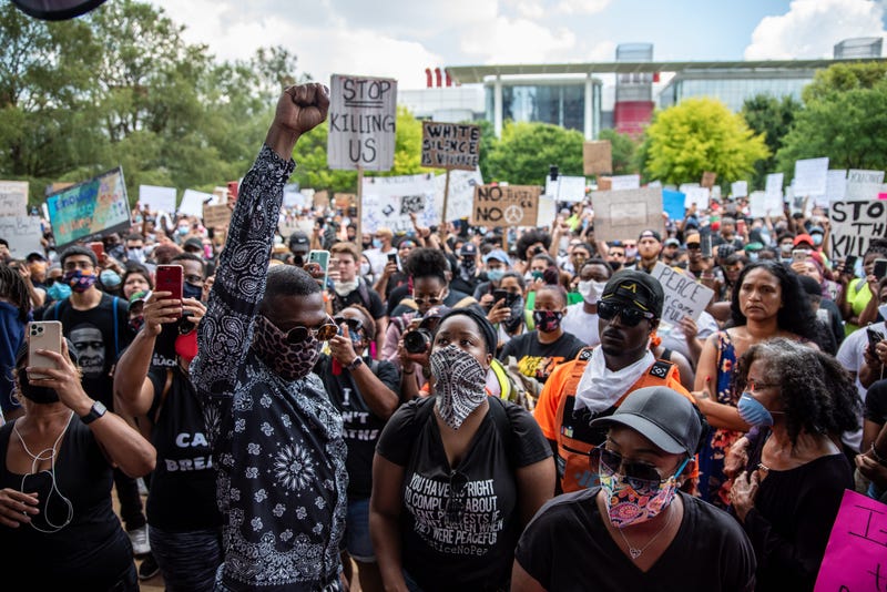 Attendees chant before a march in honor of George Floyd on June 2, 2020 in Houston,