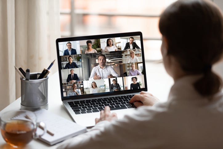 A group of people meeting online