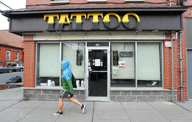 JERSEY CITY, NEW JERSEY - APRIL 27: A closed tattoo parlor is seen on April 27, 2020 in Jersey City, New Jersey. New Jersey Governor Phil Murphy issued his stay at home order on March 21st which closed non-essential business and halted public gatherings i