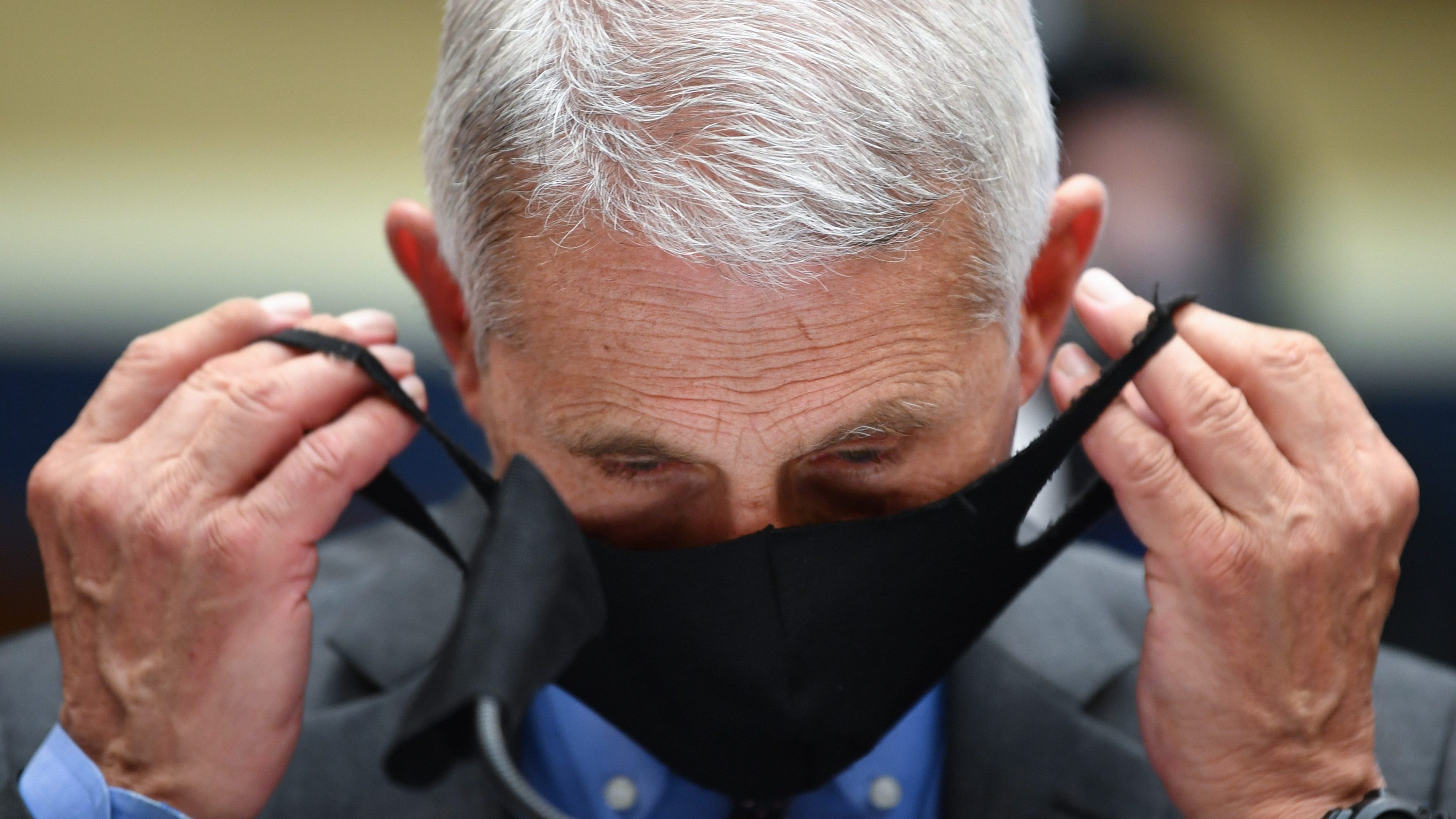 Wave and a Nod: Smiling With a Mask on Proves Challenging