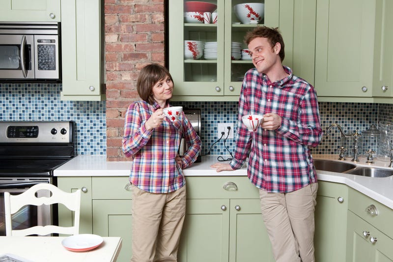 Mother and son wear matching plaid shirts
