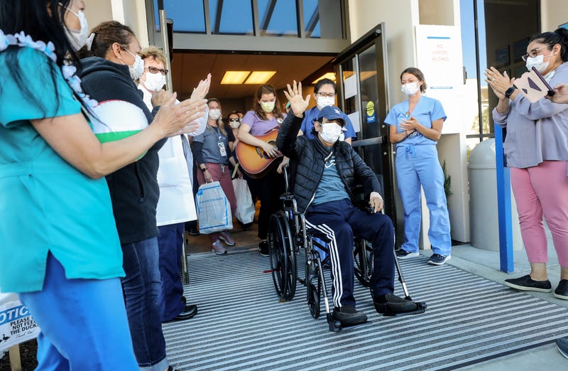 CORONADO, CALIFORNIA - MAY 08: (EDITORIAL USE ONLY) Isaias Perez Yanez, 59, is applauded by hospital staff as he is released from Sharp Coronado Hospital after battling COVID-19 for five weeks there on May 8, 2020 in Coronado, California.