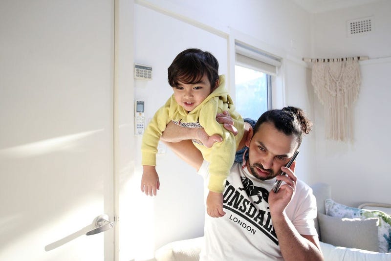 Guy on phone with kid