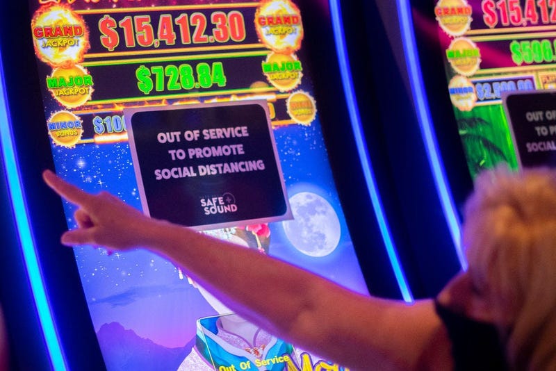 A placard is posted on a slot machine to promote social distancing at Hard Rock Casino after it reopened on July 3, 2020 in Atlantic City, New Jersey.