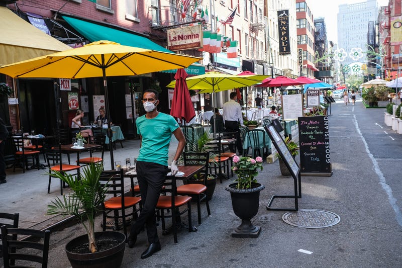 People dine al fresco in Little Italy on Mulberry Street between Hester and Broome Streets on July 4, 2020 in the Manhattan borough of New York City. 