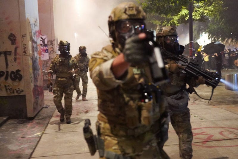 Federal police disperse a crowd of about a thousand protesters at the Mark O. Hatfield U.S. Courthouse on July 20, 2020 in Portland, Oregon.