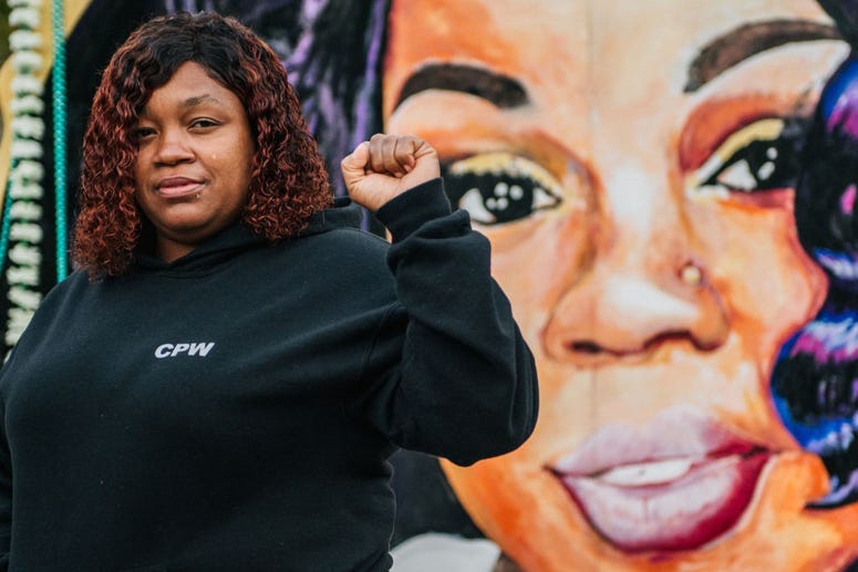  Tamika Palmer, mother of Breonna Taylor, poses for a portrait in front of a mural of her daughter at Jefferson Square park on September 21, 2020 in Louisville, Kentucky.