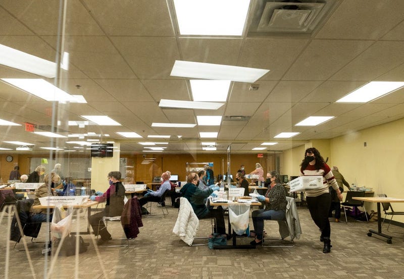 ST PAUL, MN - NOVEMBER 02: Volunteers and election officials process absentee ballots at Ramsey County's absentee ballot count center on November 2, 2020 in St Paul, Minnesota.