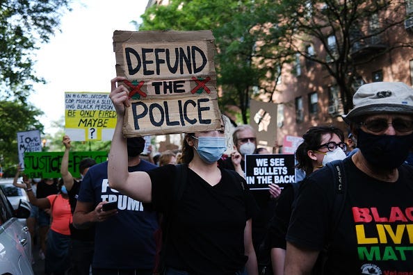 Black Lives Matter protest defund police sign