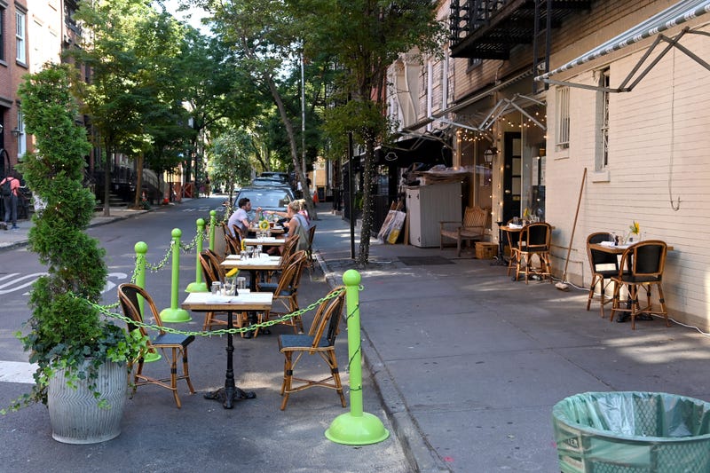 A restaurant in the West Village serves customers seated at sidewalk tables as the city moves into Phase 2 of re-opening following restrictions imposed to curb the coronavirus pandemic on June 22, 2020 in New York City.