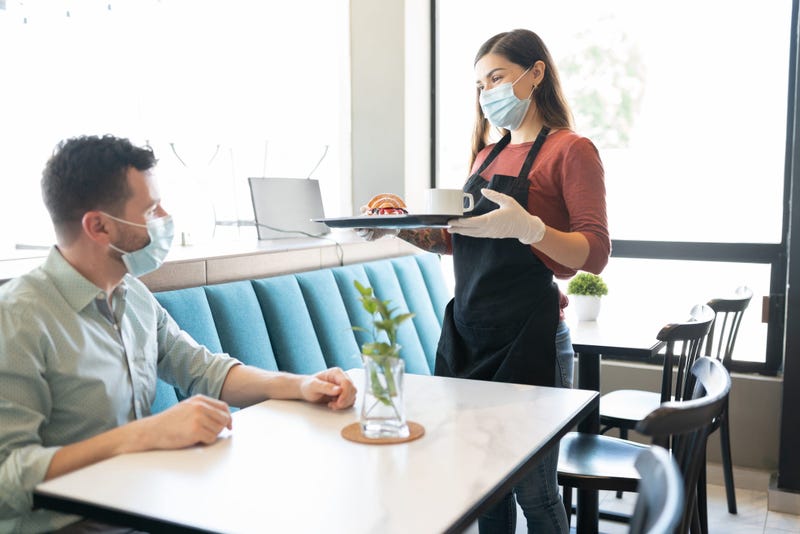 Waitress Serving Order To Customer In Cafe