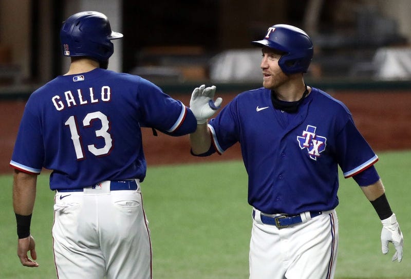 Texas Rangers players celebrate during an exhibition game.