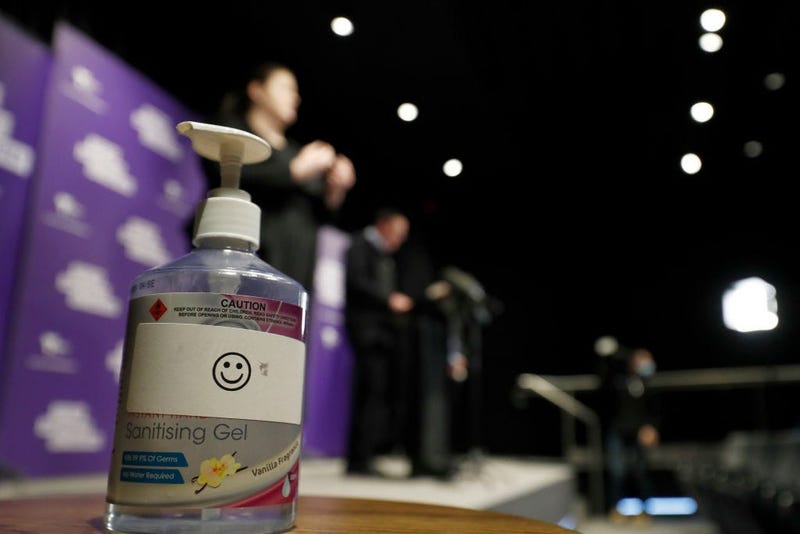 A hand sanitizer is seen as Victorian Premier Daniel Andrews speaks to the media during a daily briefing on July 25, 2020 in Melbourne, Australia.