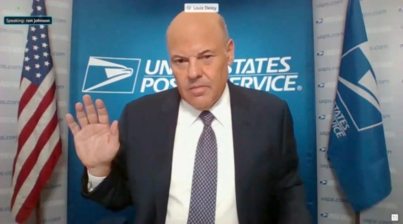 In this screenshot from U.S. Senate's livestream, U.S. Postal Service Postmaster General Louis DeJoy is sworn in for a virtual Senate Homeland Security and Governmental Affairs Committee hearing on U.S. Postal Service operations during Covid-19 pandemic.