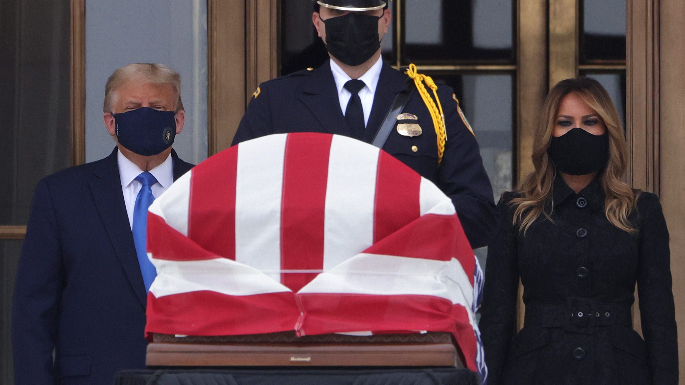 Protesters greet Trump as he arrives at Supreme Court to pay respect to RBG
