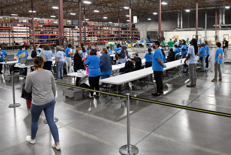  Workers process polling place equipment and materials at the Clark County Election Department after polls closed on November 3, 2020 in North Las Vegas