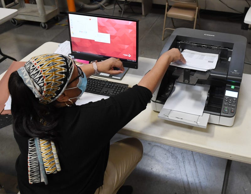 A Clark County election worker scans mail-in ballots at the Clark County Election Department on November 4, 2020 in North Las Vegas, Nevada