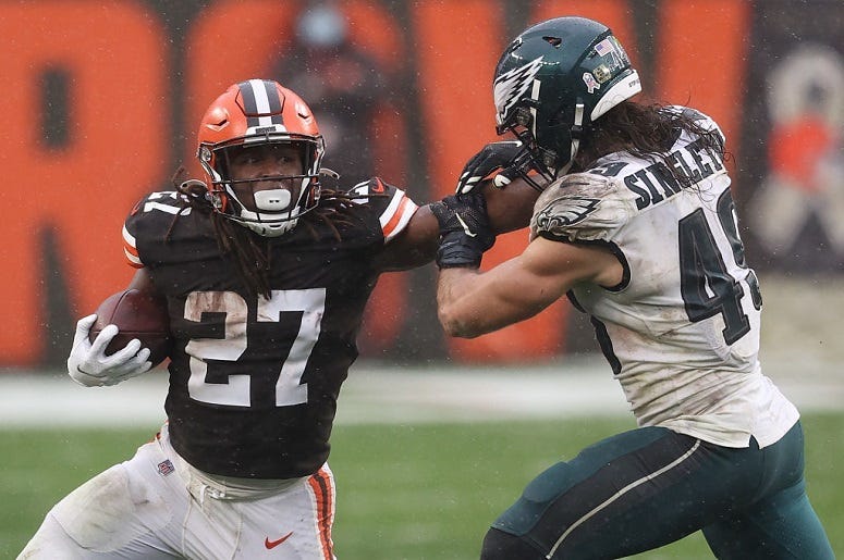 Kareem Hunt is pursued by Alex Singleton during the second half at FirstEnergy Stadium on November 22, 2020