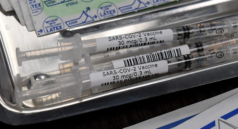 Syringes with the Pfizer-BioNTech COVID-19 vaccine are placed in a tray on a table as vaccinations are given out at University Medical Center of Southern Nevada on December 16, 2020, in Las Vegas, Nevada. 