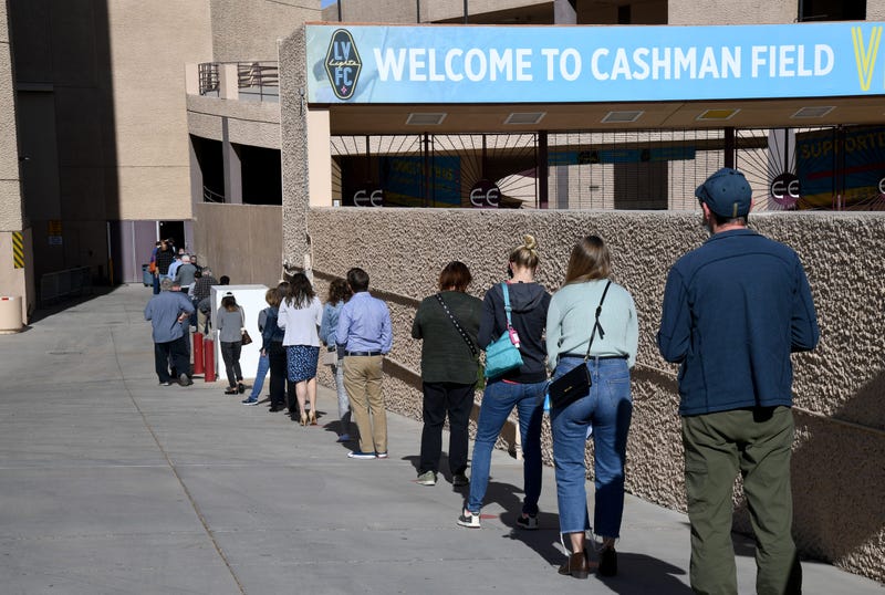 People line up on the first day of Clark County's pilot COVID-19 vaccination program at Cashman Center on January 14, 2021 in Las Vegas, Nevada.