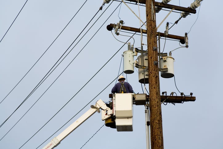 Power company worker, Repairing wires 