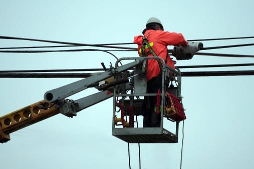 workers continue to make repairs on power lines in Northtowns