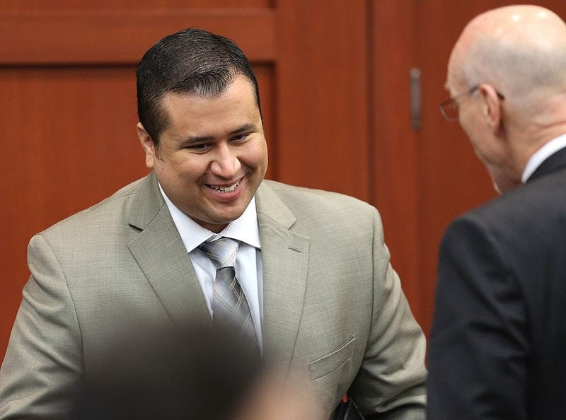 George Zimmerman smiles as he leaves the courtroom during a recess on the 21st day of his trial in Seminole circuit court, July 9, 2013 in Sanford, Florida.