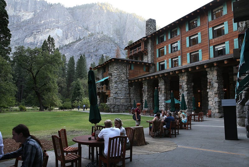 Park visitors sit outside of the Ahwahnee Hotel on August 28, 2013 in Yosemite National Park