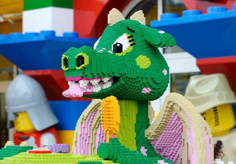 An interactive girl dragon named Bubbles takes a bath on the patio as she playfully sprays water and speaks to young guests of North America's first ever Legoland Hotel at Legoland on September 17, 2013 in Carlsbad, California.