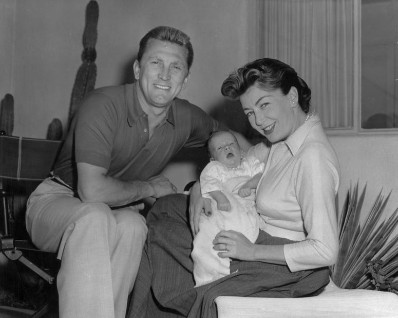  The actor Kirk Douglas with his wife Anne Buydens and their son Peter Vincent Douglas. (Photo by Keystone/Getty Images)