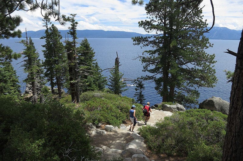 Visitors hike through DL Bliss State Park at Lake Tahoe