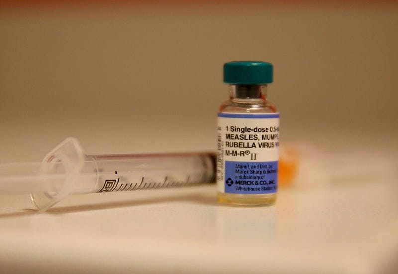 Measles vaccine and syringe