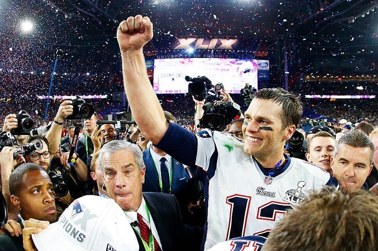 Tom Brady #12 of the New England Patriots celebrates after defeating the Seattle Seahawks 28-24 during Super Bowl XLIX