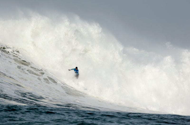 eter Mel rides a wave during the second heat of round one of Mavericks Invitational on January 24, 2014 in Half Moon Bay, California.