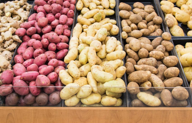 Bin of potatoes at super market