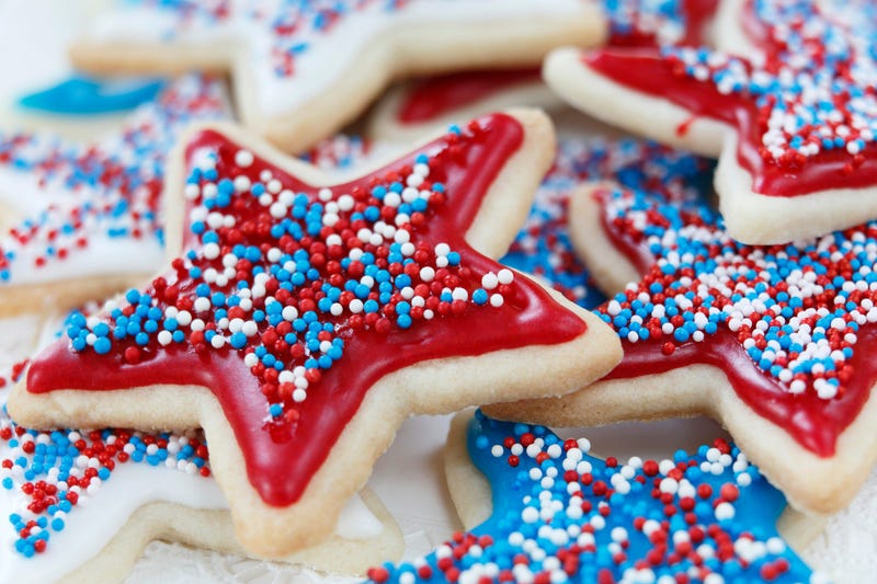 Star sugar cookies decorated for 4th of July Independence day celebration in America. Icing and sprinkles in red, white, and blue.