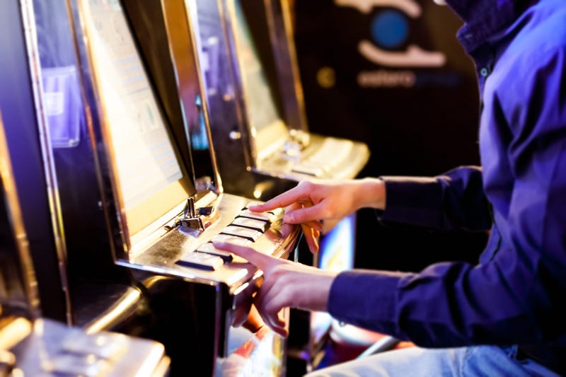 Man playing a slot machine