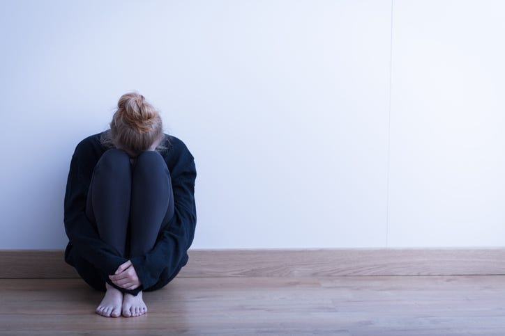 A woman sitting alone.