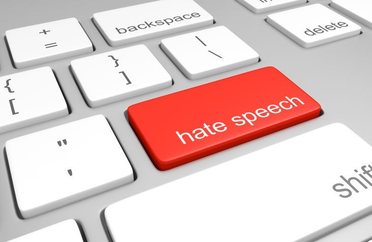 computer keyboard with one key labeled for hate speech, representing discriminatory messages that plague online message boards and comment areas.