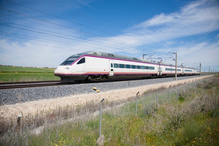 railway with high speed train at a landscape