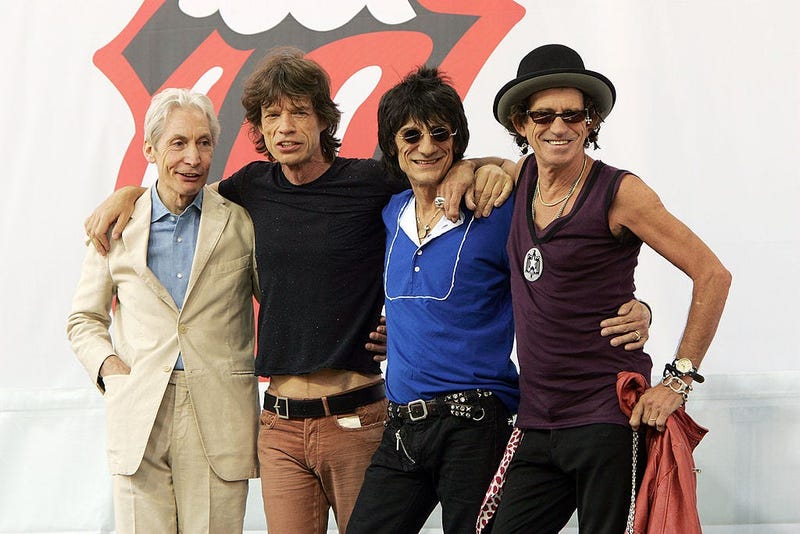(L-R) Charlie Watts, Mick Jagger, Ron Wood, and Keith Richards of The Rolling Stones pose for a photo during a press conference to announce a world tour at the Julliard Music School May 10, 2005 in New York City.