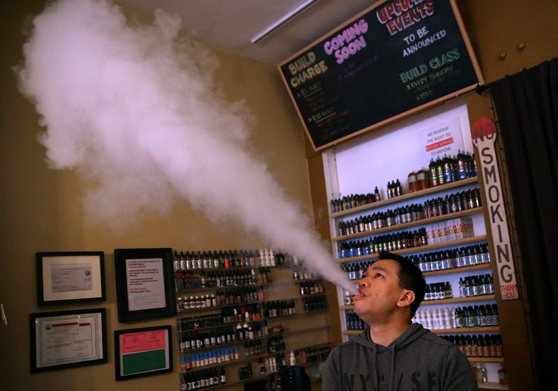 Christopher Chin blows vapor from an e-cigarette at Gone With the Smoke Vapor Lounge on May 5, 2016 in San Francisco, California.