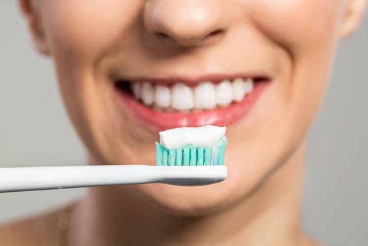Woman Brushing Her Teeth