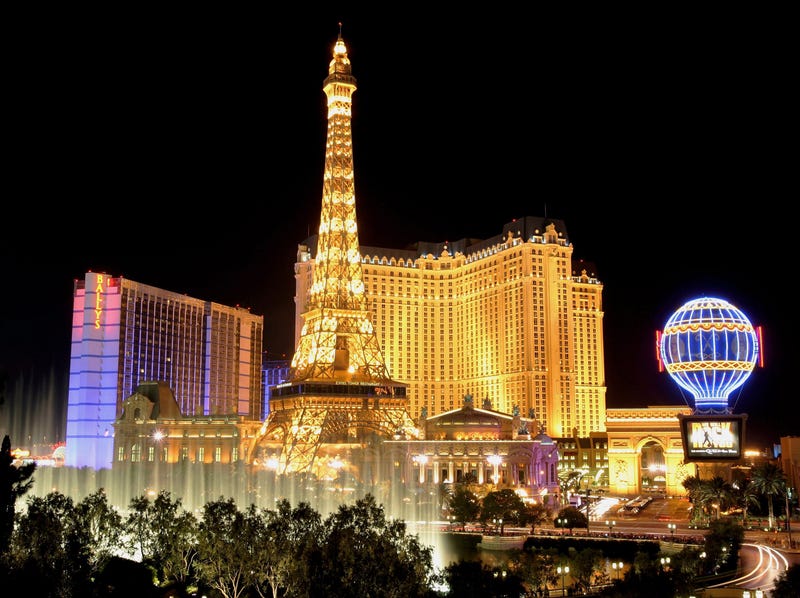 Water from the Bellagio's fountain show is seen in front of the Bally's Las Vegas (L) and Paris Las Vegas, including the Paris' 50-story Eiffel Tower replica, June 30, 2005 in Las Vegas, 