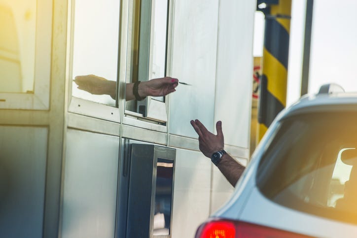 Paying tolls. 