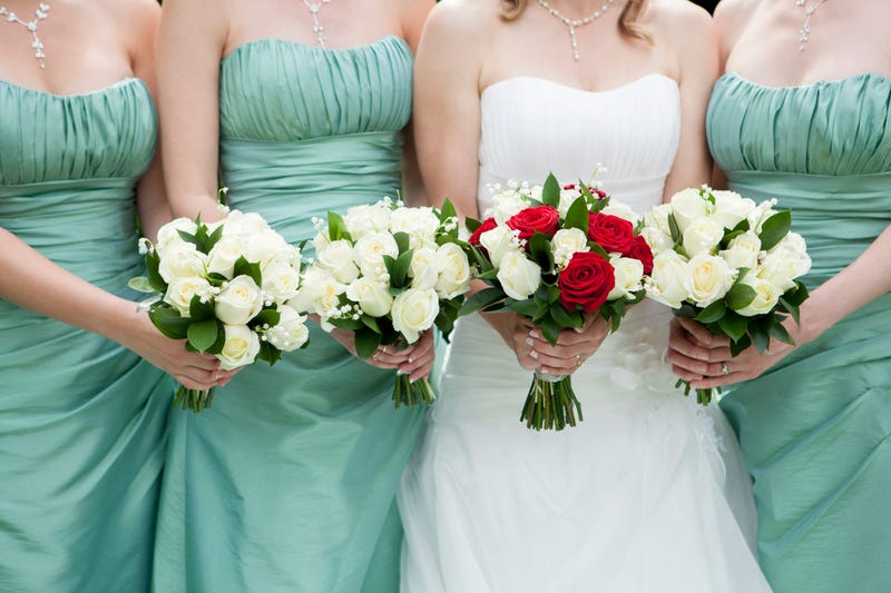 Bride and bridesmaids holding bouquets