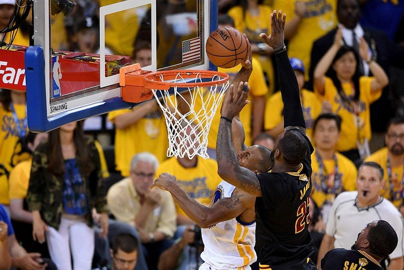 OAKLAND, CA - JUNE 19: LeBron James #23 of the Cleveland Cavaliers blocks a shot by Andre Iguodala #9 of the Golden State Warriors in Game 7 of the 2016 NBA Finals at ORACLE Arena on June 19, 2016 in Oakland, California. NOTE TO USER: User expressly ackno